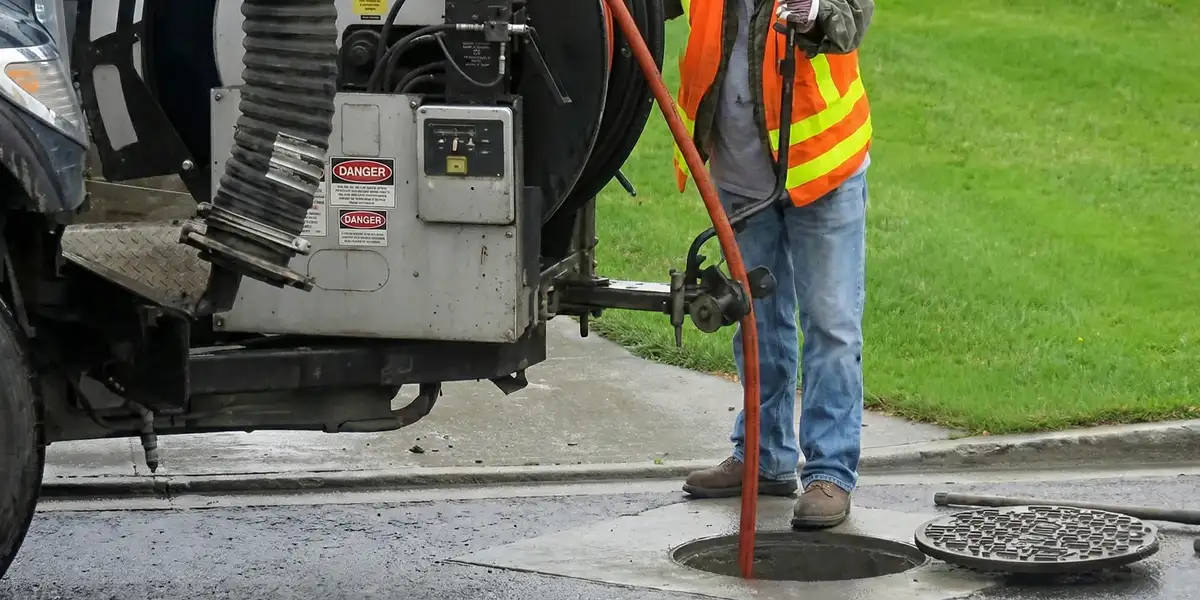 sewage clean up professionals using industrial equipment to remove contaminated wastewater in Mesa, AZ