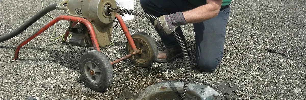 sewer rodding technician actively removing blockages from a sewer line in Mesa, AZ